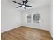 Bright bedroom featuring hardwood floors, a ceiling fan, and windows that provide natural light at 1111 Osborne Sw St, Atlanta, GA 30310