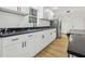 Well-lit kitchen featuring white cabinets and marble countertops at 1111 Osborne Sw St, Atlanta, GA 30310