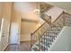 Spacious entryway with hardwood floors and elegant staircase at 3865 Chastatee Dr, Duluth, GA 30097