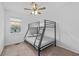 Bedroom with bunk bed, ceiling fan and window at 2858 Spring Villa Se Ln, Smyrna, GA 30080