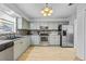 Modern kitchen with stainless steel appliances and light cabinets at 2858 Spring Villa Se Ln, Smyrna, GA 30080