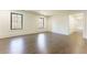 Bright bedroom featuring hardwood floors and multiple windows at 5666 Long Island Nw Dr, Atlanta, GA 30327