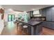 Open concept kitchen with gray cabinets and large island at 5666 Long Island Nw Dr, Atlanta, GA 30327