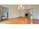 Formal dining room with hardwood floors, chandelier, and view of kitchen at 960 Todd Dr, Covington, GA 30014