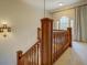 Upper landing with a large window and wooden railing at 960 Todd Dr, Covington, GA 30014