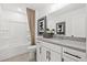 Well-lit bathroom featuring white cabinets and modern fixtures at 5756 Tillman Way, Powder Springs, GA 30127