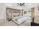 Serene bedroom featuring a tray ceiling, neutral tones, and large windows for natural light at 5756 Tillman Way, Powder Springs, GA 30127