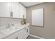 Functional laundry room with ample counter space and modern cabinetry at 5756 Tillman Way, Powder Springs, GA 30127