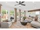 Comfortable living room with a large window and neutral decor; the perfect space for relaxing at 5756 Tillman Way, Powder Springs, GA 30127