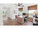 Cozy home office with a ceiling fan, wood-paneled walls, and lots of natural light at 5756 Tillman Way, Powder Springs, GA 30127
