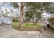 Wide, grassy backyard with mature trees, shed, and storage containers at 1770 Rockland Se Dr, Atlanta, GA 30316