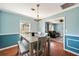 Charming dining room with a wooden table set and an elegant light fixture at 1770 Rockland Se Dr, Atlanta, GA 30316