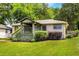 Charming home with a welcoming front porch, manicured lawn, and vibrant landscaping at 1770 Rockland Se Dr, Atlanta, GA 30316