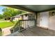 Cozy front porch with a wooden floor and railings, creating a welcoming entrance to the house at 1770 Rockland Se Dr, Atlanta, GA 30316