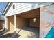 Open garage with exposed ceiling rafters and painted concrete walls at 1770 Rockland Se Dr, Atlanta, GA 30316