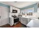 Bright kitchen featuring white cabinetry, stainless steel appliances, and ample natural light at 1770 Rockland Se Dr, Atlanta, GA 30316
