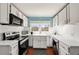 Well-lit kitchen with white cabinets and modern appliances, perfect for culinary enthusiasts at 1770 Rockland Se Dr, Atlanta, GA 30316