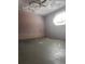 Unfinished basement with textured ceiling, light purple walls and tile accents at 220 Canterbury Ln, Lawrenceville, GA 30046