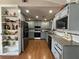 Galley style kitchen with gray cabinets and granite countertops at 220 Canterbury Ln, Lawrenceville, GA 30046