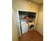 Laundry room with washer, dryer and storage shelves at 220 Canterbury Ln, Lawrenceville, GA 30046