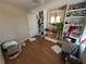 Small laundry room with wood floors and built-in shelving at 220 Canterbury Ln, Lawrenceville, GA 30046