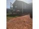 Elevated rear exterior view with blue siding and partially covered ground level at 220 Canterbury Ln, Lawrenceville, GA 30046