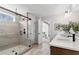 Modern bathroom showcasing a glass shower, a view of the commode, and a window view of the outdoors at 5270 Birch Valley Rd, Cumming, GA 30028