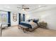 Bright and airy main bedroom with a neutral color palette and plenty of natural light at 5270 Birch Valley Rd, Cumming, GA 30028