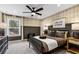 Stylish bedroom with plaid wallpaper, a cozy bed, and a well-coordinated decor scheme at 5270 Birch Valley Rd, Cumming, GA 30028
