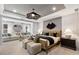Inviting bedroom retreat with a seating area, ample natural light, and stylish furnishings at 5270 Birch Valley Rd, Cumming, GA 30028