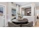 Charming dining area with a round table, comfortable seating, and natural light from the adjacent door at 5270 Birch Valley Rd, Cumming, GA 30028