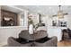 A stylish dining area with access to the kitchen, featuring a round table and modern decor at 5270 Birch Valley Rd, Cumming, GA 30028