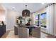 Dining room with a round table, modern lighting, and a large window at 5270 Birch Valley Rd, Cumming, GA 30028