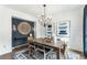 Dining room with wooden table, shiplap wall, and statement lighting at 5270 Birch Valley Rd, Cumming, GA 30028