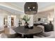 Dining room featuring a round table, modern decor, and a stylish pendant light at 5270 Birch Valley Rd, Cumming, GA 30028