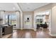 Bright entryway with a white front door, large windows, and hardwood floors at 5270 Birch Valley Rd, Cumming, GA 30028