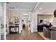 Bright entryway with hardwood floors, an arched mirror, and views into the living areas beyond at 5270 Birch Valley Rd, Cumming, GA 30028