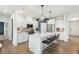 Modern kitchen with white cabinets, quartz countertops, and stainless steel appliances at 5270 Birch Valley Rd, Cumming, GA 30028