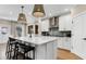Kitchen with an island, quartz countertops, modern appliances, and eat in seating at 5270 Birch Valley Rd, Cumming, GA 30028