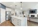 Open concept kitchen boasts a large island and stainless steel appliances at 5270 Birch Valley Rd, Cumming, GA 30028