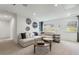 Spacious living area features a comfortable sectional sofa and large windows at 5270 Birch Valley Rd, Cumming, GA 30028