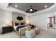 Comfortable bedroom featuring a decorative ceiling, carpet floors, and view to an adjoining living area at 5270 Birch Valley Rd, Cumming, GA 30028