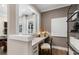 A cozy home office space featuring a built-in desk, natural light, and modern decor at 5270 Birch Valley Rd, Cumming, GA 30028