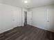 Spacious bedroom with ample closet space and wood-look floors at 9129 Bent Pine Ne Ct, Covington, GA 30014