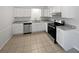 Bright kitchen featuring white cabinets, stainless steel appliances, and granite countertops at 9129 Bent Pine Ne Ct, Covington, GA 30014