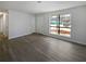 Bright living room with grey vinyl plank flooring and large windows at 9129 Bent Pine Ne Ct, Covington, GA 30014