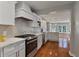 Modern kitchen with white cabinets and quartz countertops at 1949 Westminster Ne Way, Atlanta, GA 30307