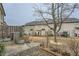 A fenced backyard with a lawn, patio, and a tree at 162 Townview Dr, Woodstock, GA 30189
