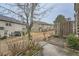 Backyard with a small brick patio, a tree, and some greenery along the fence at 162 Townview Dr, Woodstock, GA 30189