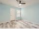 A cozy bedroom with a ceiling fan and a window that provides natural light at 162 Townview Dr, Woodstock, GA 30189